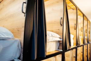 a room with bunk beds and a mirror at Хостел 1377 in Astana