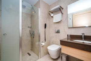 a bathroom with a shower and a toilet and a sink at ANGEL'S PARK HOTEL in Denizli +40 photos