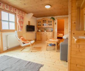 a living room with a couch and a table at Bergbauernhof Untermoos in Taxenbach