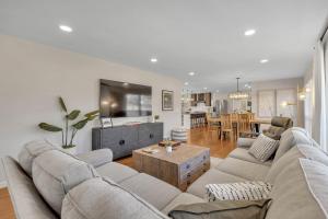 a living room with a couch and a table at Newly Remodeled Home Minutes from MTSU Short drive to downtown Nashville in Murfreesboro
