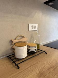 a shelf with three bowls on top of a floor at Zio Nino in Sutomišćica