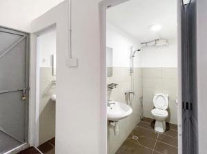 a bathroom with a toilet and a sink at Pearl Cottage - 2min Drive to Lam Wah Ee Hospital in George Town +20 photos