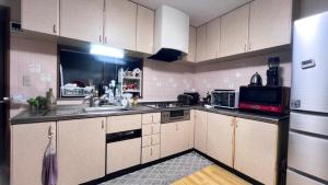 A kitchen or kitchenette at Kitayama Fuji View House