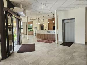 an office with a lobby with a reception desk at Hotel Ossowski in Swarzędz