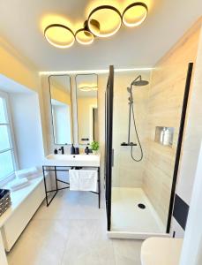 a bathroom with a sink and a shower at Stylish Riga Old Town getaway in Riga +8 photos