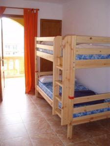 Кровать или кровати в номере Cala Mesquida