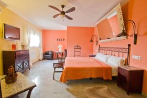 Postel nebo postele na pokoji v ubytování Hostal Nueva Andalucia
