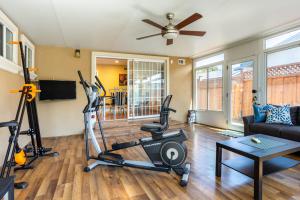 a living room with a gym with a treadmill at Wine Waves & Comfort 2BR Bay Area Beauty in Hayward
