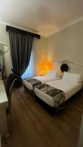 A bed or beds in a room at Zanhotel Tre Vecchi