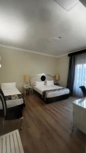 A bed or beds in a room at Zanhotel Tre Vecchi