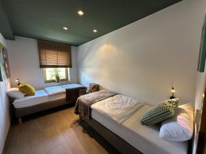 Llit o llits en una habitació de Maison Kaiser