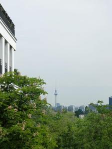 a view of a city with a tv tower in the distance at berlincity in Berlin +16 photos