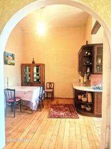 a kitchen with a table and chairs in a room at Best Place in Tbilisi Center for lucky people!!!! in Tbilisi City