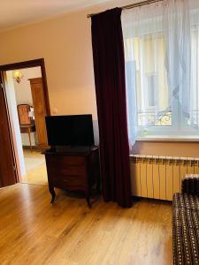 Telewizja i/lub zestaw kina domowego w obiekcie Pod Katedrą