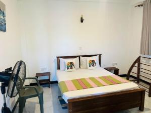 Postel nebo postele na pokoji v ubytování kandy hill villa