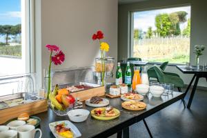 a table with plates of food on top of it at Vigna delle Rose in Trecase