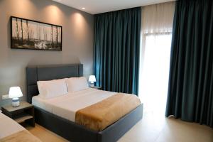 Postel nebo postele na pokoji v ubytování Atrium Deluxe Resort + 37 fotografií