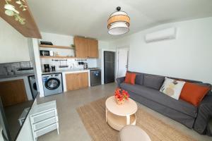 a living room with a couch and a table at Diplomat Suites in Marmaris
