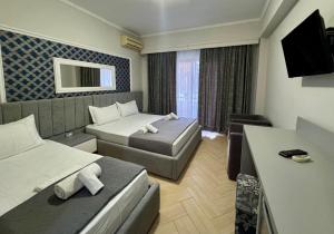 TV a/nebo společenská místnost v ubytování Hotel Pini