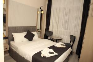 Postel nebo postele na pokoji v ubytování Mar Blanco Hotel
