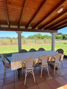a table and chairs on a patio at Casa María B - a 3km del Camino in Santa Eulalia