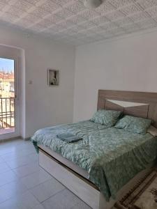 Postel nebo postele na pokoji v ubytování CASA COMPARTIDA SIn ASCENSOR ELDA