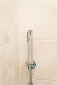 a shower head in a shower stall with a shower at Aragona Bed & Breakfast in Santa Maria a Vico