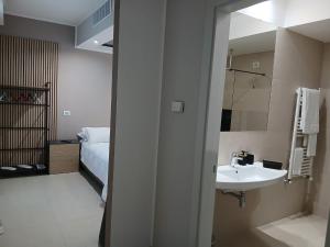 Postel nebo postele na pokoji v ubytování LHI Healthy Hotel Lecce