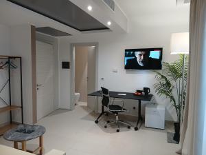TV a/nebo společenská místnost v ubytování LHI Healthy Hotel Lecce
