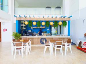 Restaurace v ubytování Apartamentos Palmetto - Frente al Mar