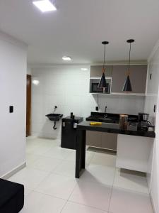 Kuchyň nebo kuchyňský kout v ubytování Kitnet Residencial Ebenézer