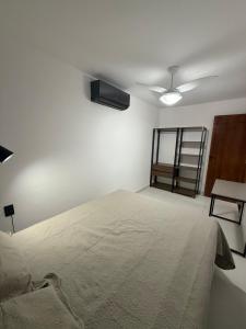 Postel nebo postele na pokoji v ubytování Kitnet Residencial Ebenézer + 4 fotografie