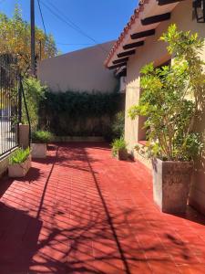 a red brick walkway in front of a house at Las Vellon in San Pedro +8 photos