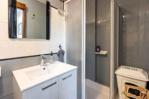 a bathroom with a sink and a shower and a toilet at Holiday home in Crikvenica 45055 in Crikvenica +32 photos
