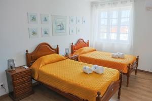 Postel nebo postele na pokoji v ubytování Albergue de São Bento