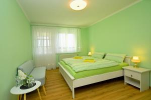 Katil atau katil-katil dalam bilik di Ferienhaus Weitblick