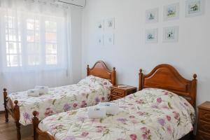 Postel nebo postele na pokoji v ubytování Albergue de São Bento