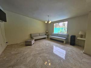 Ruang duduk di Tornameza Casa de Campo