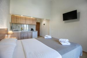 Postel nebo postele na pokoji v ubytování Athina Villas