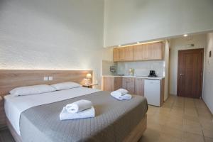 Postel nebo postele na pokoji v ubytování Athina Villas