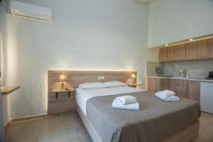 Postel nebo postele na pokoji v ubytování Athina Villas