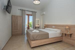 Postel nebo postele na pokoji v ubytování Athina Villas