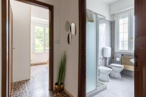 a bathroom with a toilet and a sink at Marina Dream 200 Meters From The Sea in Marina di Ravenna