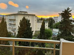 a view of a building from a balcony at Appartement L'ECRIN DES EMPEREURS in Saint-Raphaël