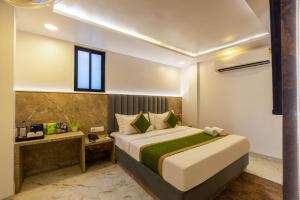 Postel nebo postele na pokoji v ubytování Hotel All In Homes - New Delhi Railway station- Paharganj