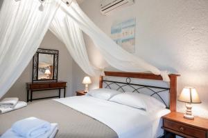 Postel nebo postele na pokoji v ubytování Athina Villas
