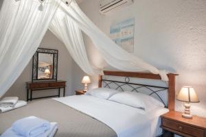 Postel nebo postele na pokoji v ubytování Athina Villas