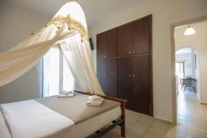 Postel nebo postele na pokoji v ubytování Athina Villas