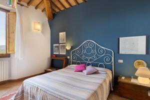 A bed or beds in a room at La Ripa - Appartamento I Ghiri Még 23 kép