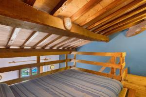 A bed or beds in a room at La Ripa - Appartamento I Ghiri